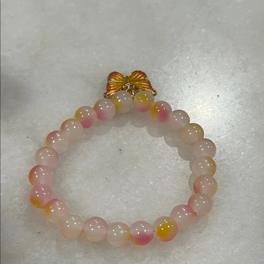 Elegant Pink and Yellow Beaded Bracelet with Butterfly Charm